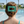 Person with a striped hair clip in a pool area