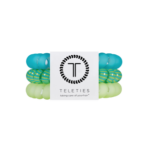 Set of green and blue hair ties with Teleties branding on a white background