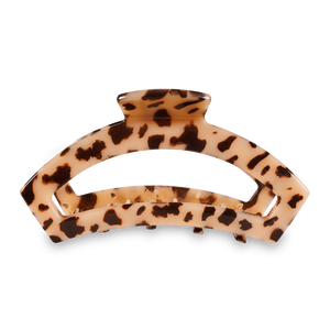 Tortoiseshell patterned hair clip on a white background