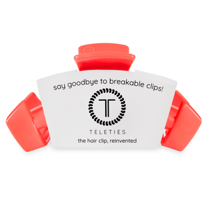 Red hair clip with Teleties branding on a white background