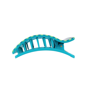 Blue hair clip with green accents on a white background