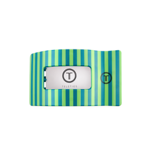 Striped hair clip with a brand label on a white background