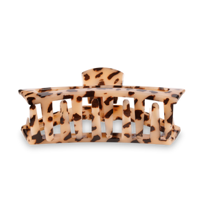 Tortoiseshell patterned hair clip on a white background